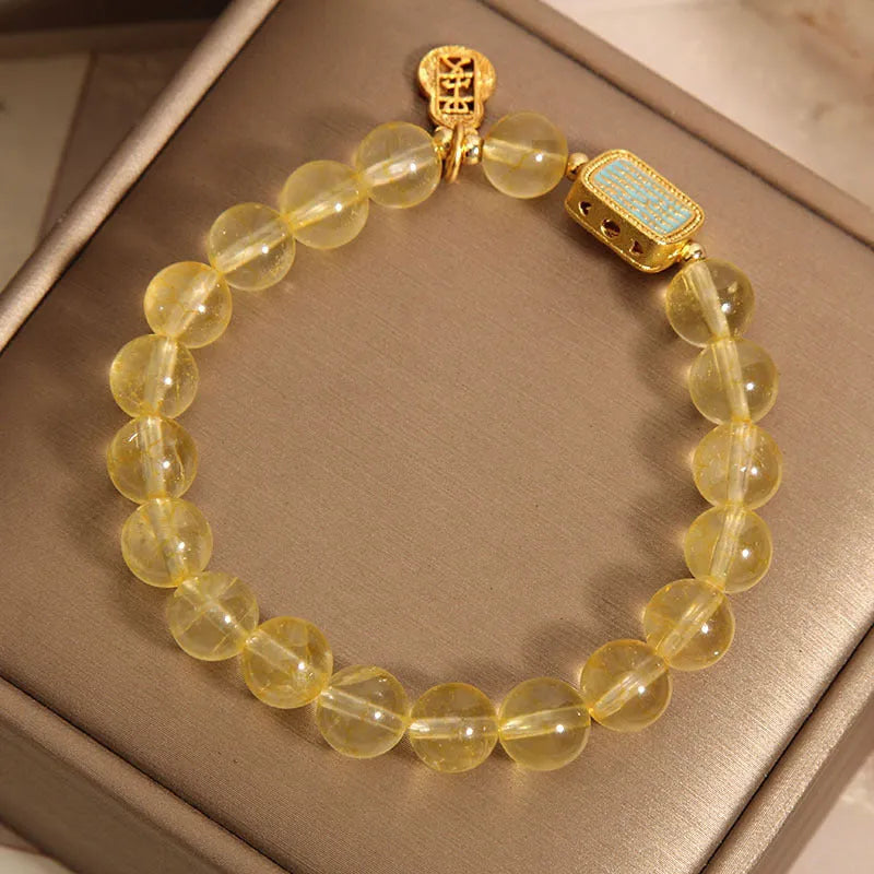 Women's natural yellow crystal bracelet with citrine colour and rhinestone detailing