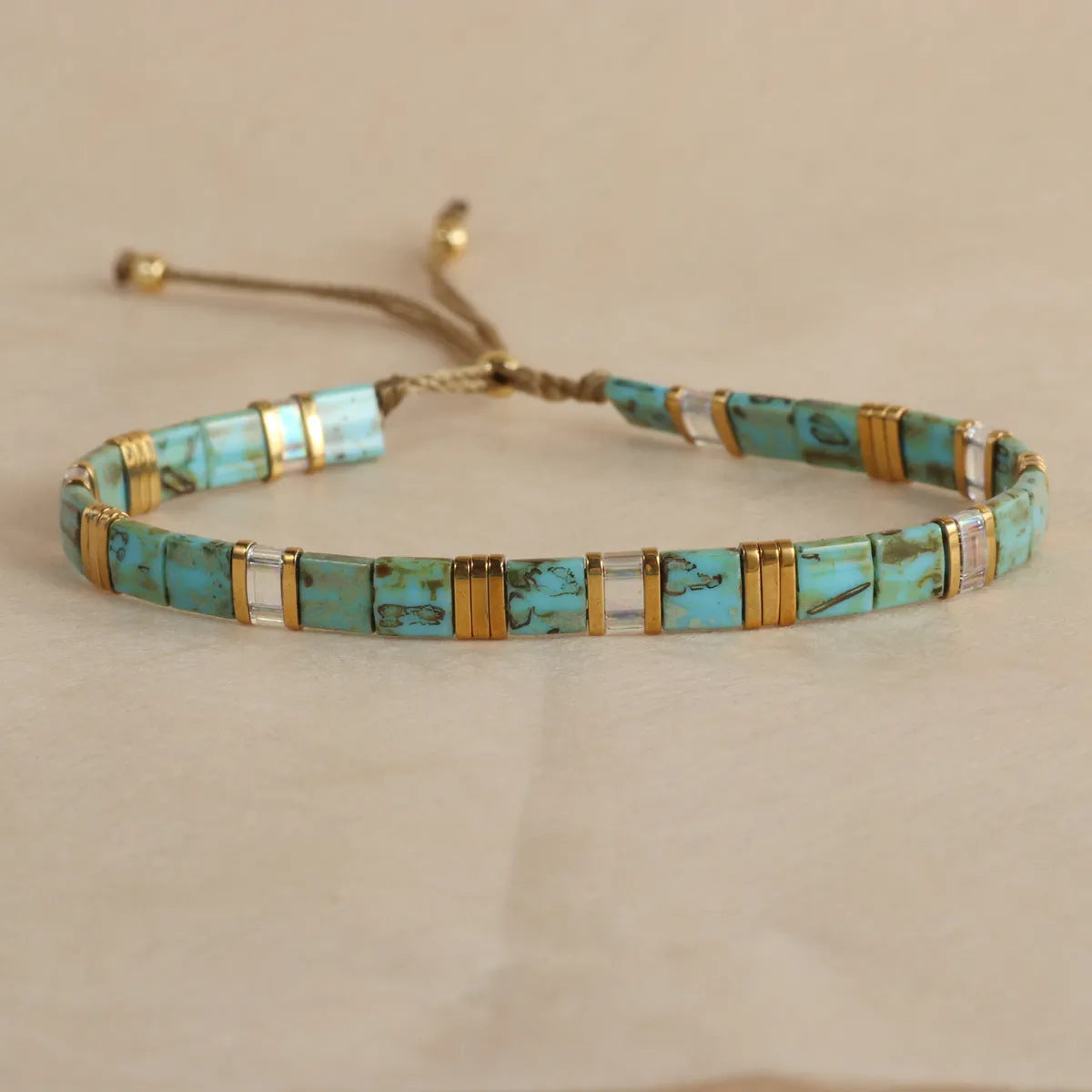 Geometric pull bead glass bracelet in multiple colour options on wrist
