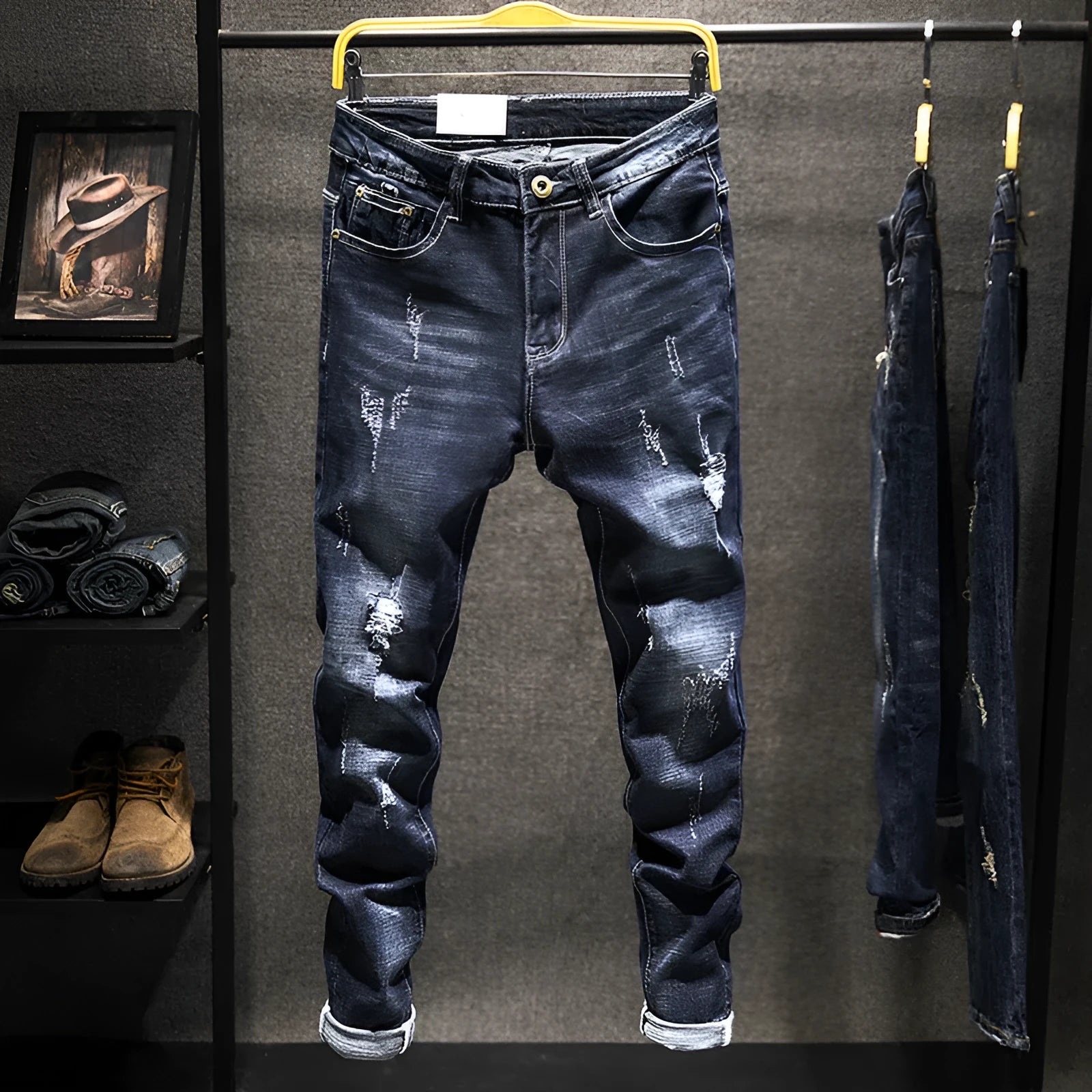 Men's slim-fit skinny jeans in dark blue denim laid flat, showing front design and button fly.