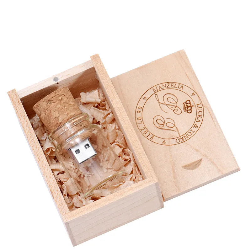 Chocolate-brown wooden drift bottle-shaped USB flash drive with custom lettering graphics on a wooden disk.