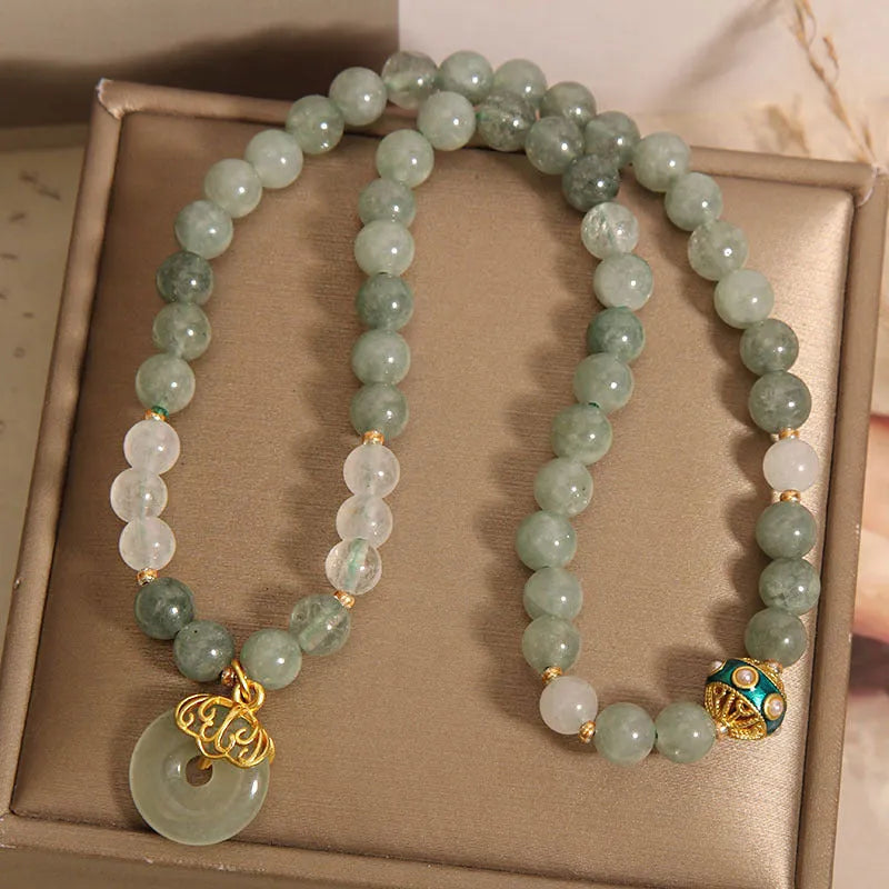 Aventurine double-layer jade bracelet with rhinestone accents and peace buckle closure in emerald green