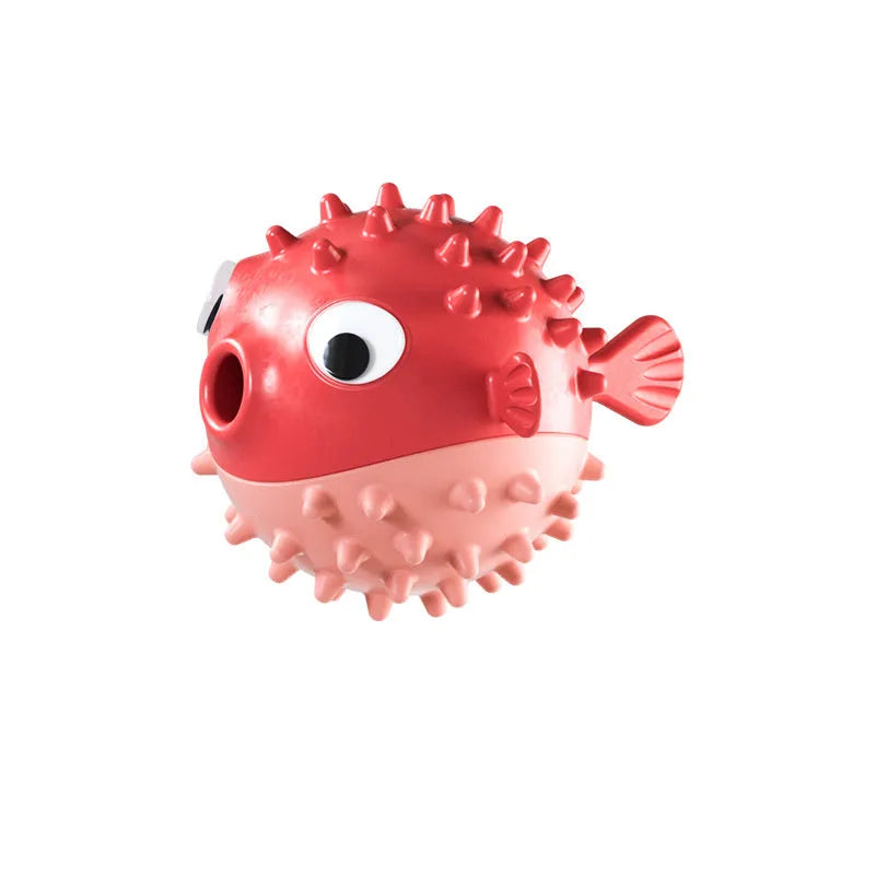 Green fish-shaped interactive dog toy with textured surface for medium and large breeds