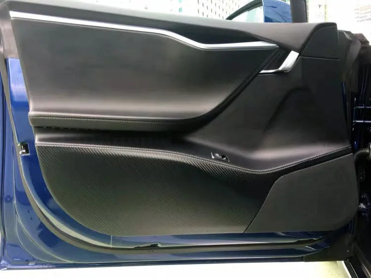 Four carbon fibre protective film pieces for Tesla Model S interior door panels.