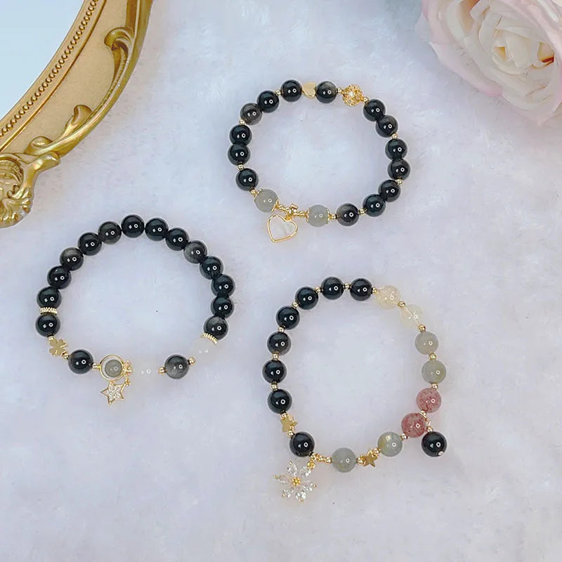 Silverstone electroplated women's bracelet with adjustable clasp and choice of floral, heart, or star charm designs