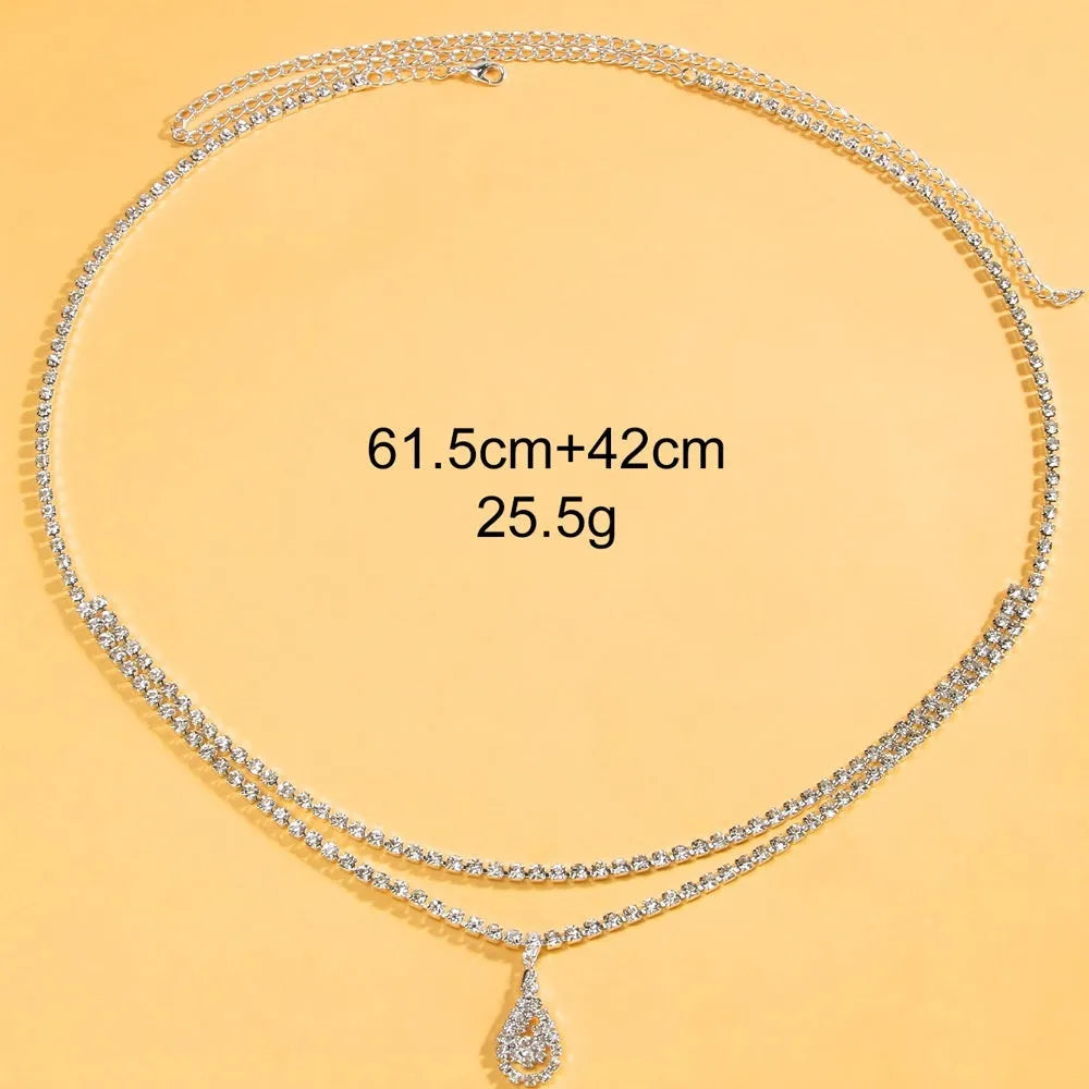 Gold or silver waist chain with a water drop rhinestone pendant and lobster buckle.