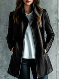 Women's solid black medium-length leather jacket with long sleeves laid flat.