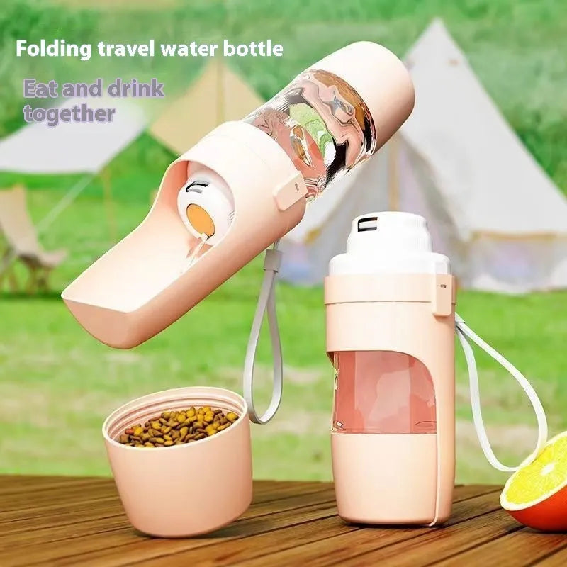 Grey foldable 2-in-1 dog water bottle and feeder with lanyard, showing food and water compartments.
