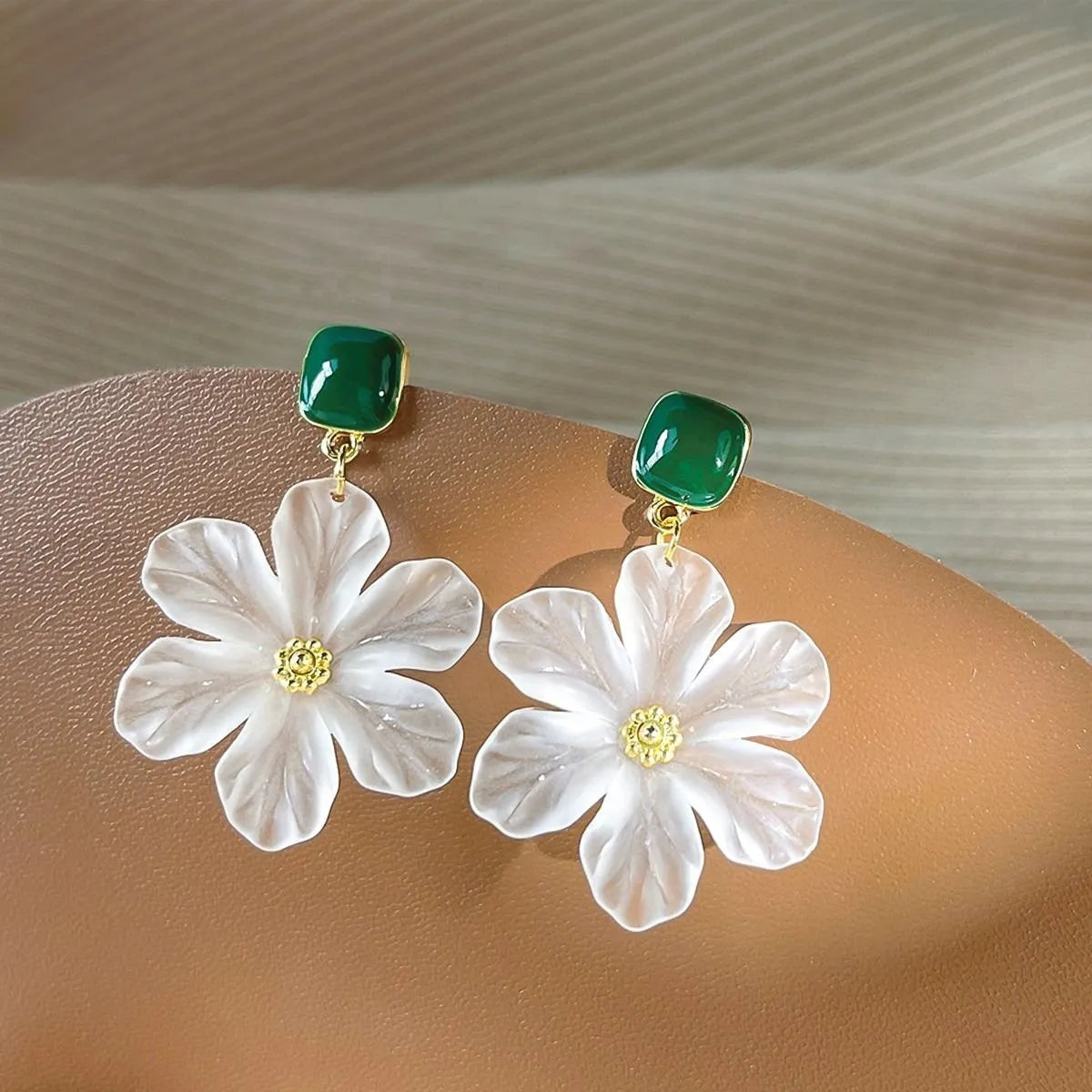 Dark green floral drop earrings with sterling silver finish and needle flowers design