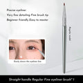 Angled bend head eyeliner makeup brush for detail eye work and tear trough application.