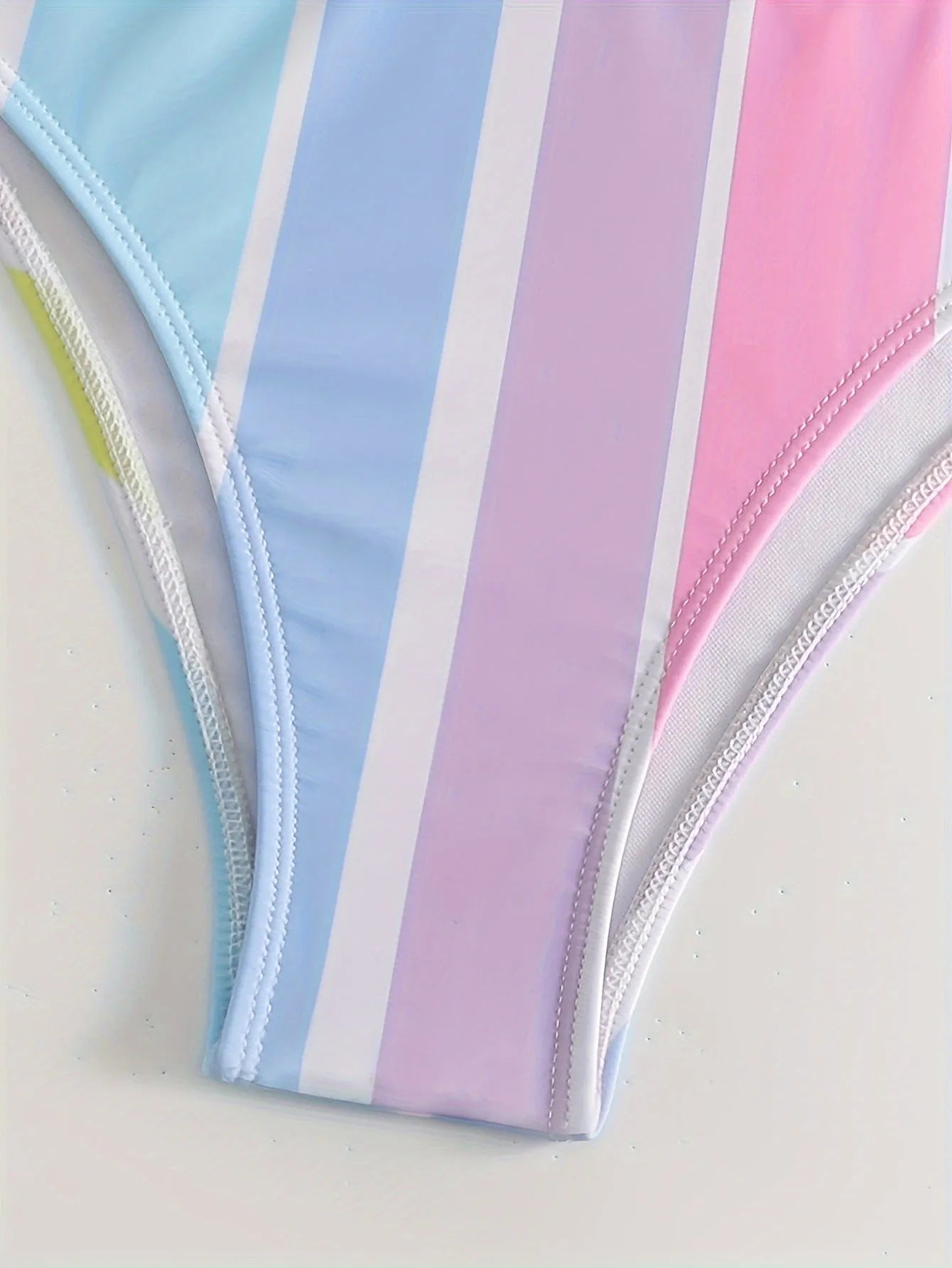 Women's striped sport bikini set with briefs style top and pants for swimming.