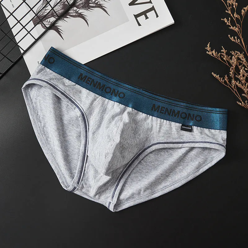 Men's solid colour cotton low waist briefs on a white background.
