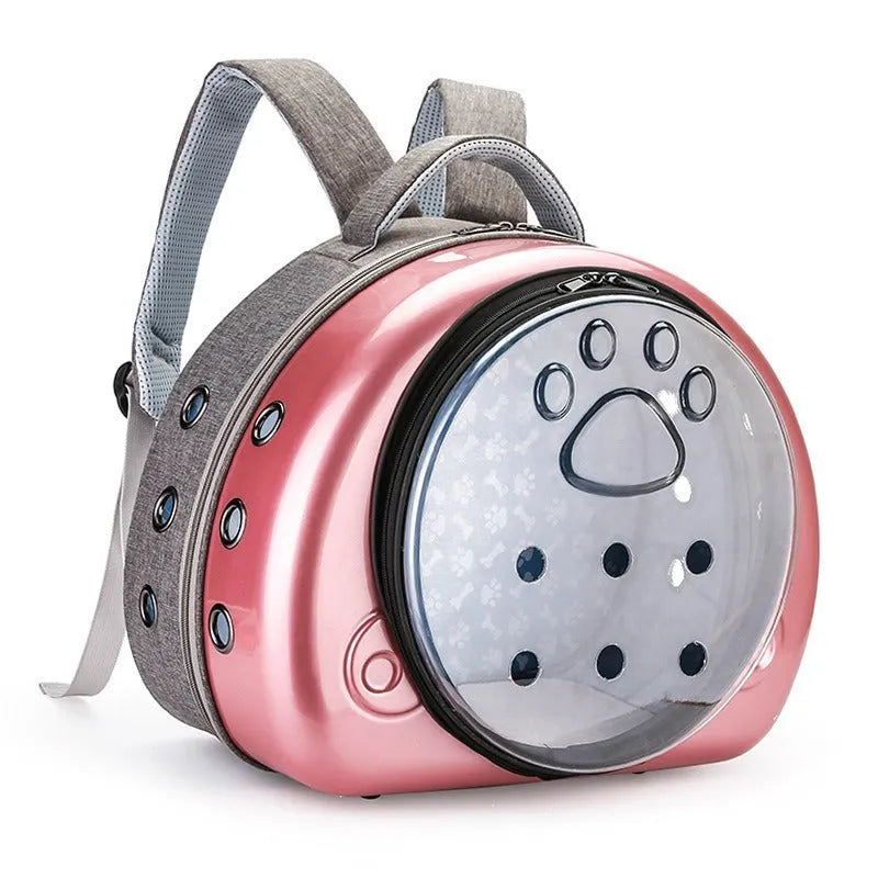 Transparent space capsule cat carrier backpack in PC canvas with metallic hard shell cover.