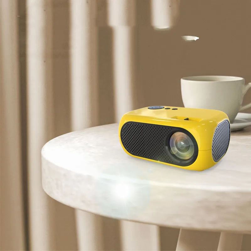 M24 portable micro projector in gold or white colour with power adapter and AV cable