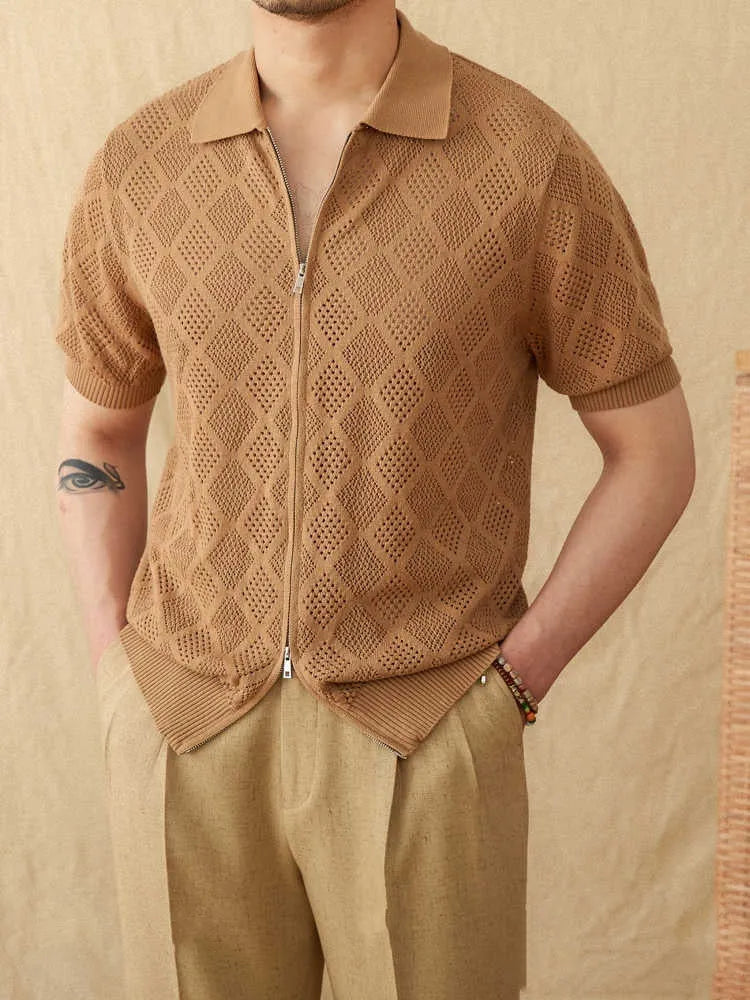 Light brown cotton short sleeve cardigan with lapel collar and front zipper on a hanger.