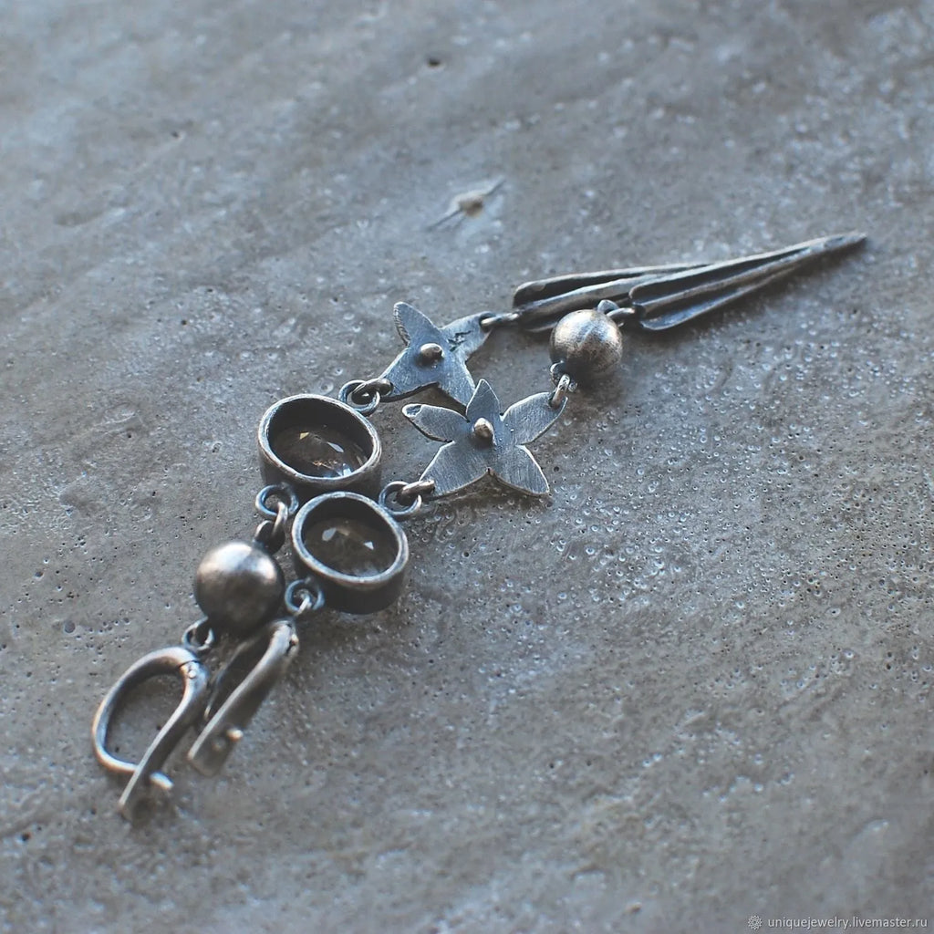 Geometric xingx design pendant earrings with rhinestone accents in antique silver finish