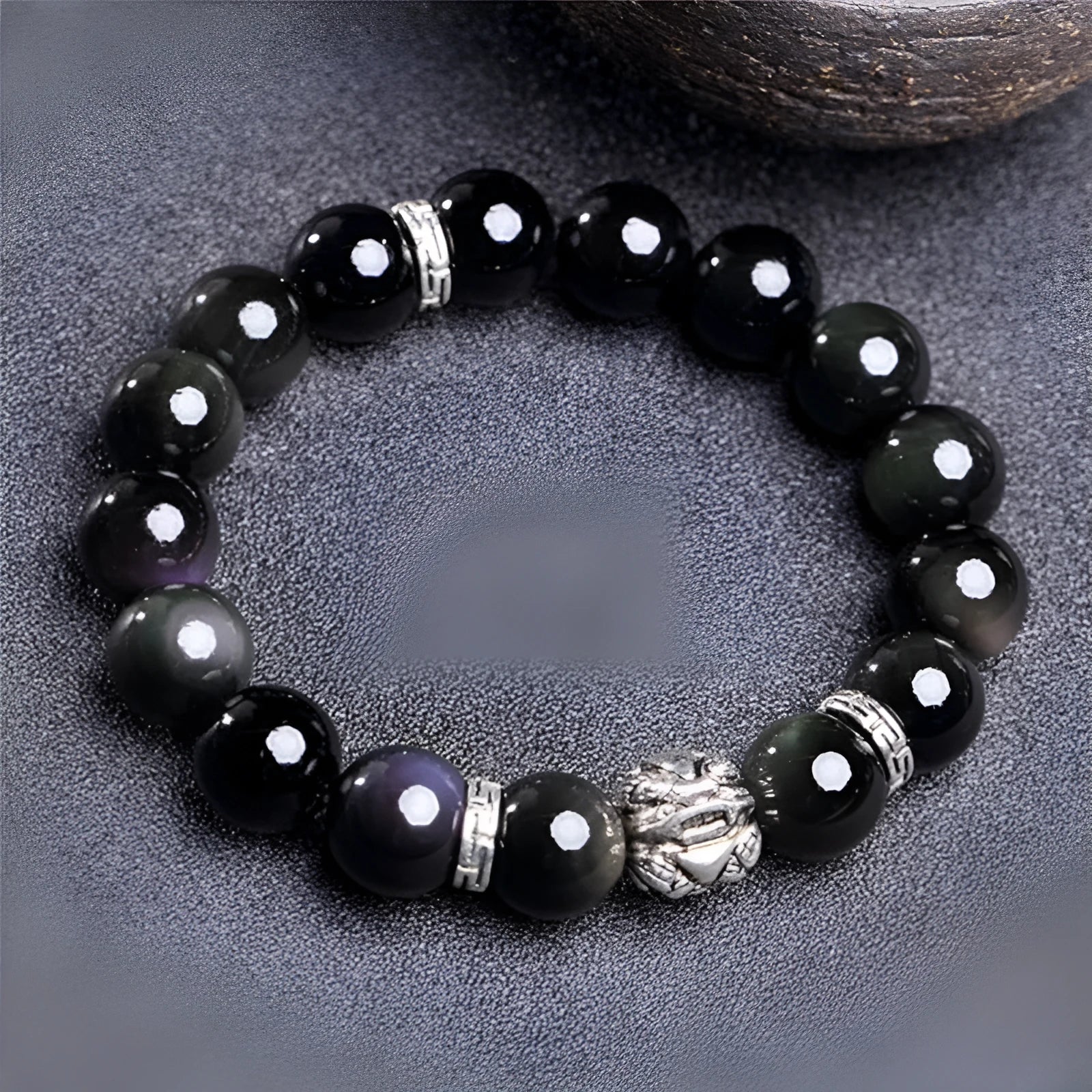 Natural obsidian bead bracelet with silver 999 details, showing male 12mm and female 10mm size options.