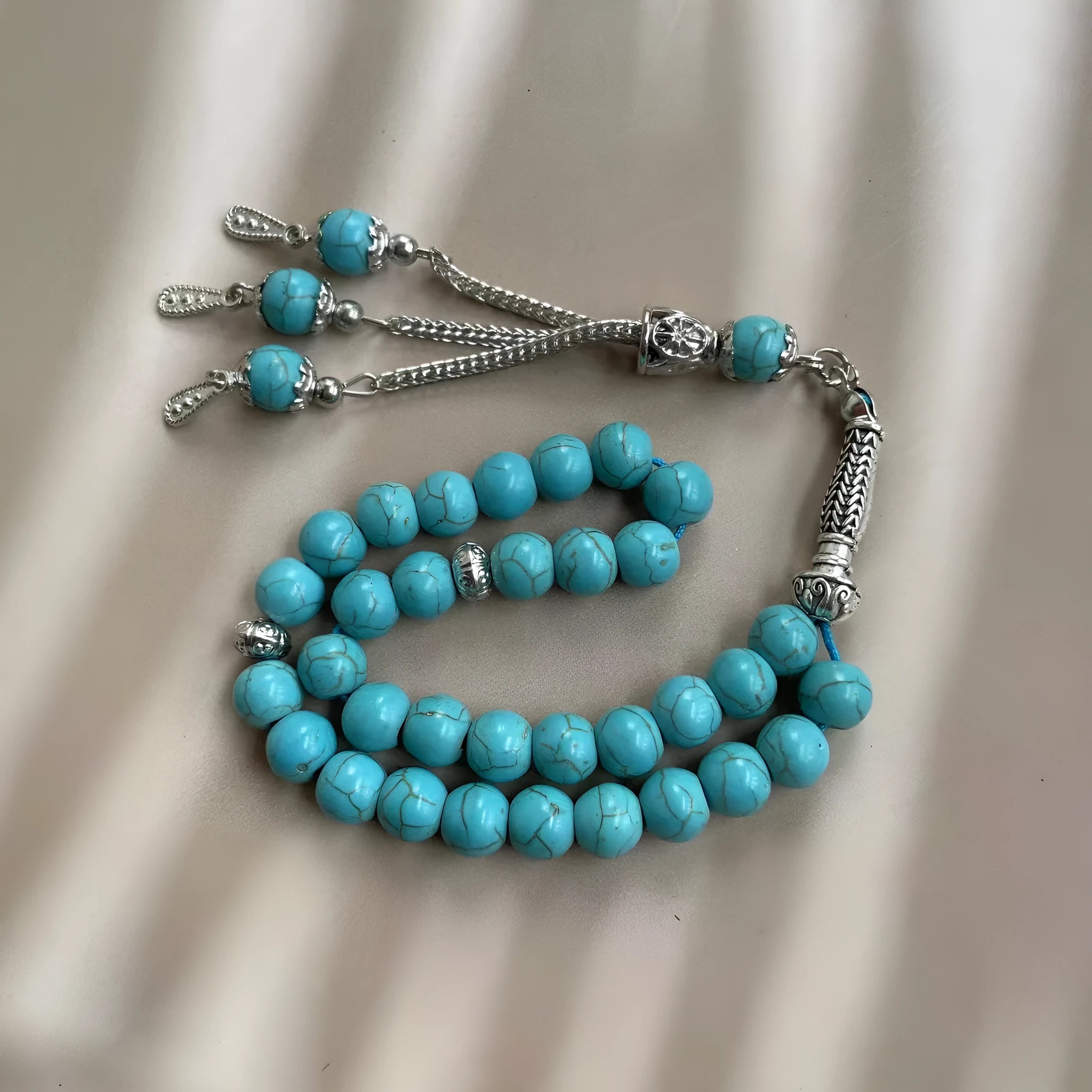 Handmade Muslim daily worship bracelet with 8mm sky blue stone beads on wrist