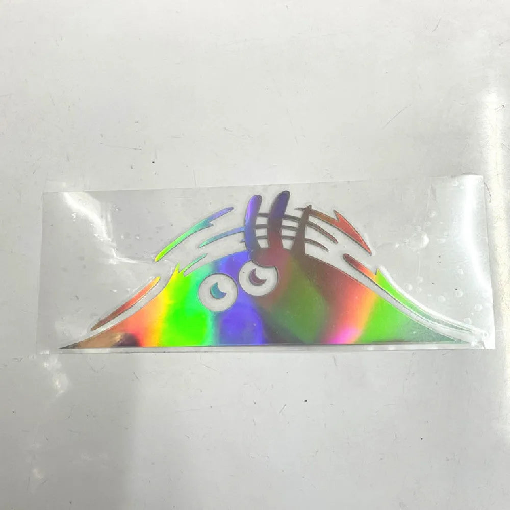 Self-adhesive body sticker showing a colourful smiley face design, measuring 19cm by 7cm.