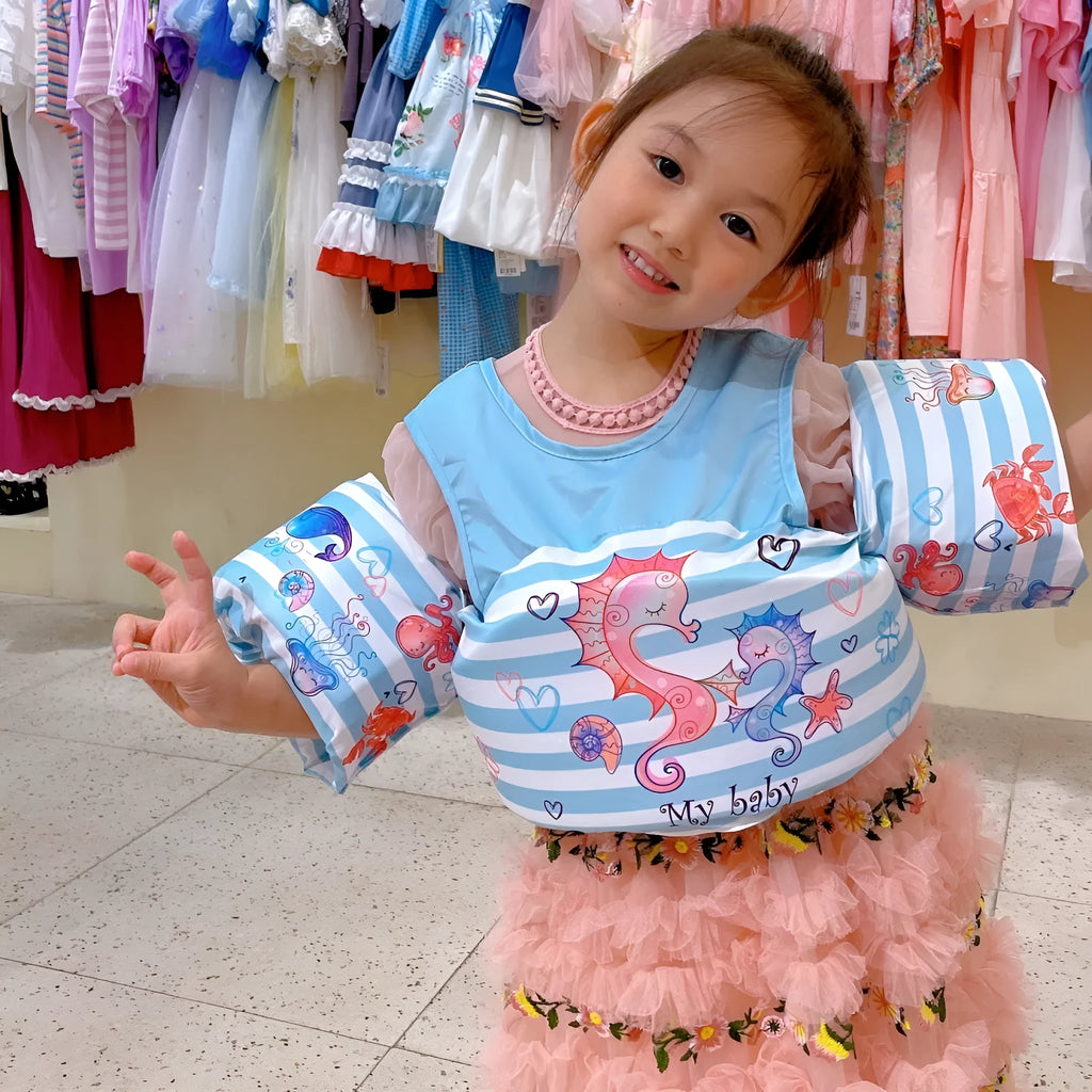 Cartoon children's swimsuit with integrated arm swimming rings in colourful watermelon pineapple design