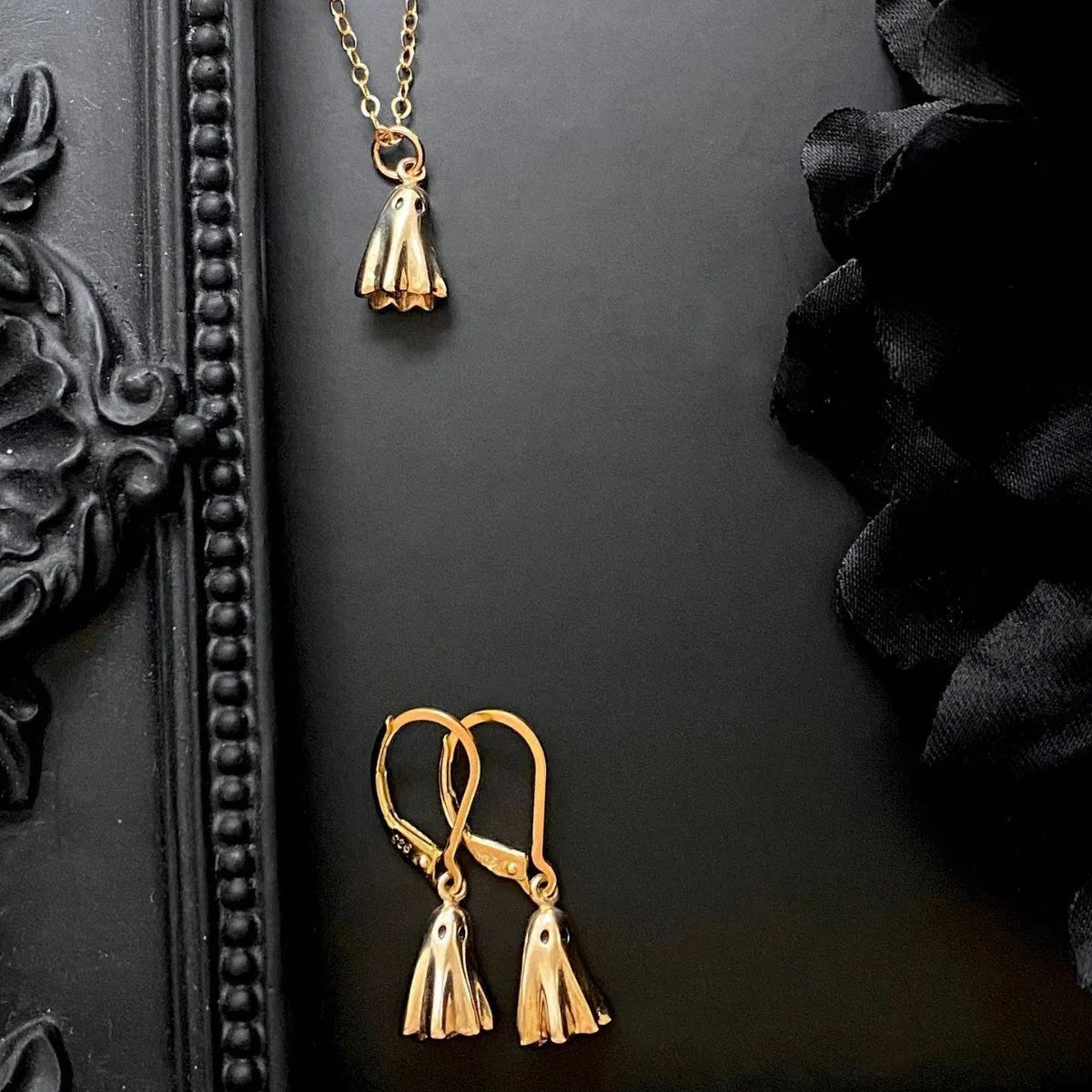 Ghost pendant necklace on twisted stainless steel chain with titanium steel detail