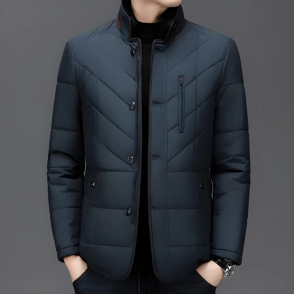 Men's dark blue short winter coat with side pockets and a full zip, showing cotton-padded construction.