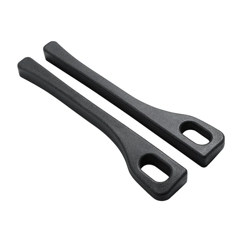 A pair of polyurethane car seat gap strips in beige colour on a car seat.