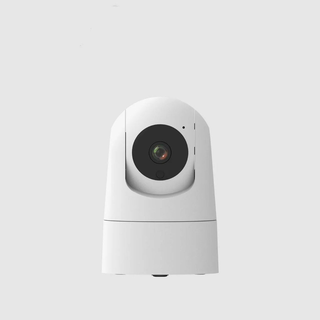 White indoor smart security camera on a table with UK power plug