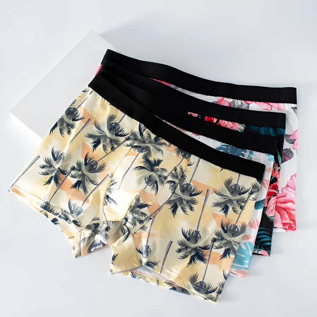 Men's printed underwear in polyester ice silk fabric on a size chart showing waist and length measurements.
