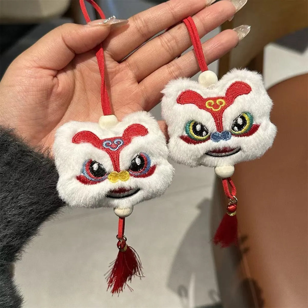 Blue Chinese style plush lion keychain ornament with tassels and star stone detail