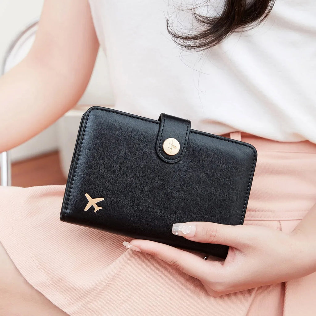 PU leather passport holder with RFID protection in multiple colour options including pink, black, and blue