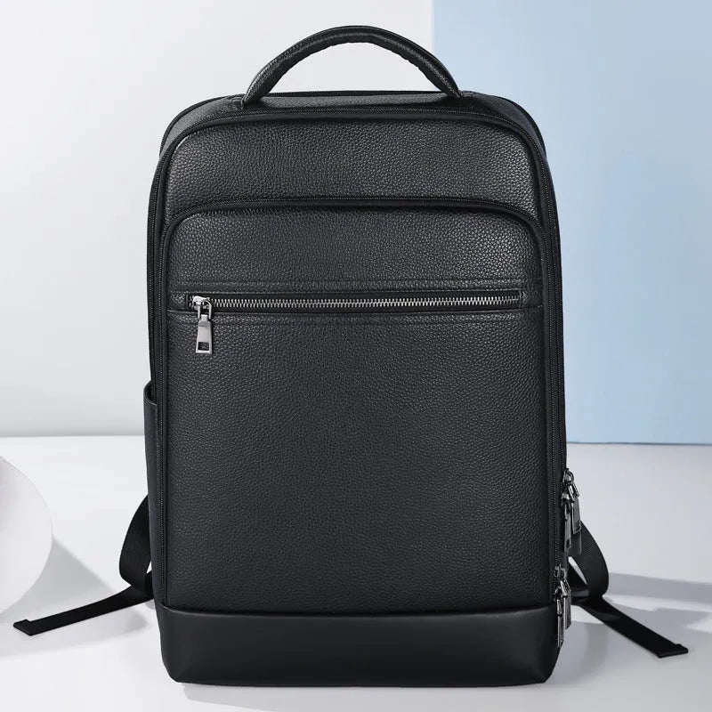 Black genuine leather men's business laptop backpack with curved shoulder straps and visible sewing details