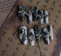 Blue evening manicure set with rose pattern on plastic nail armour suit
