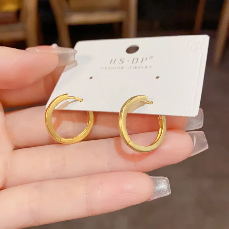 Copper geometric ear clips with gold plating in gold and silver colour options