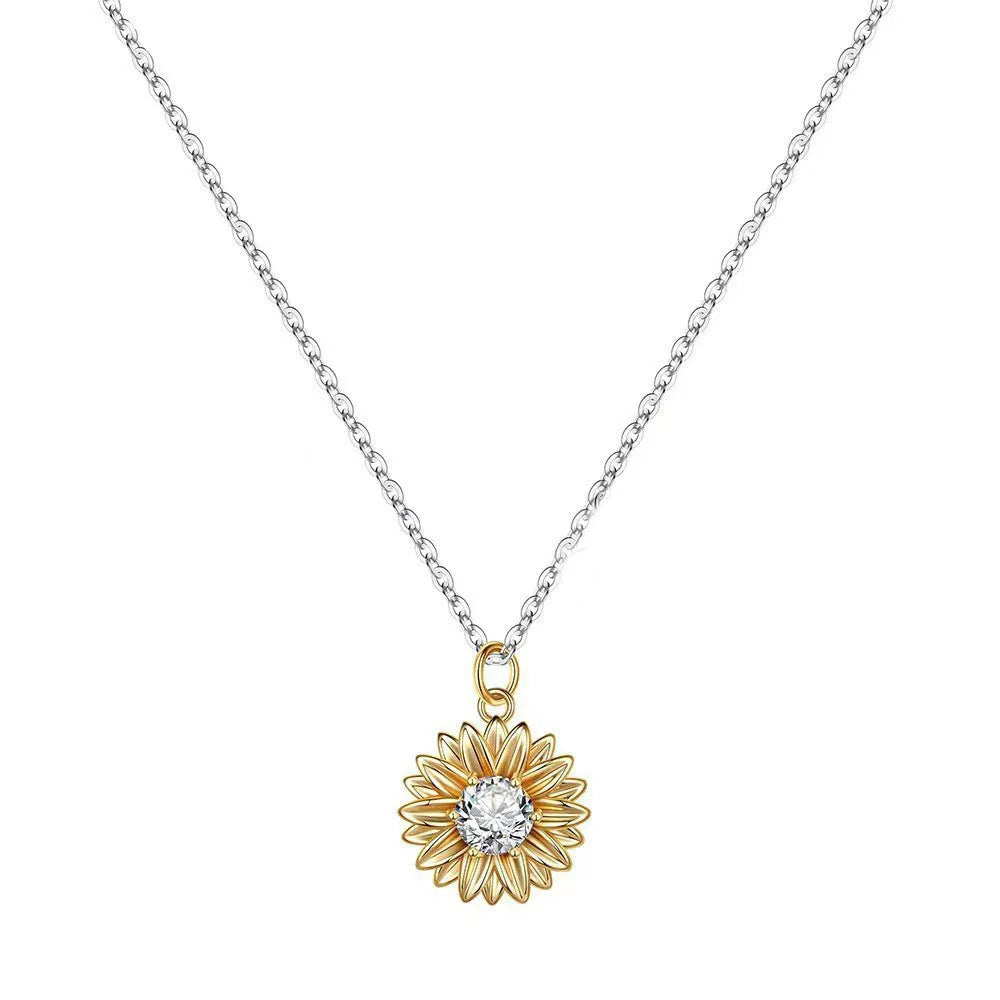 Women's sterling silver sunflower necklace with geometric petal pendant on a cross chain.