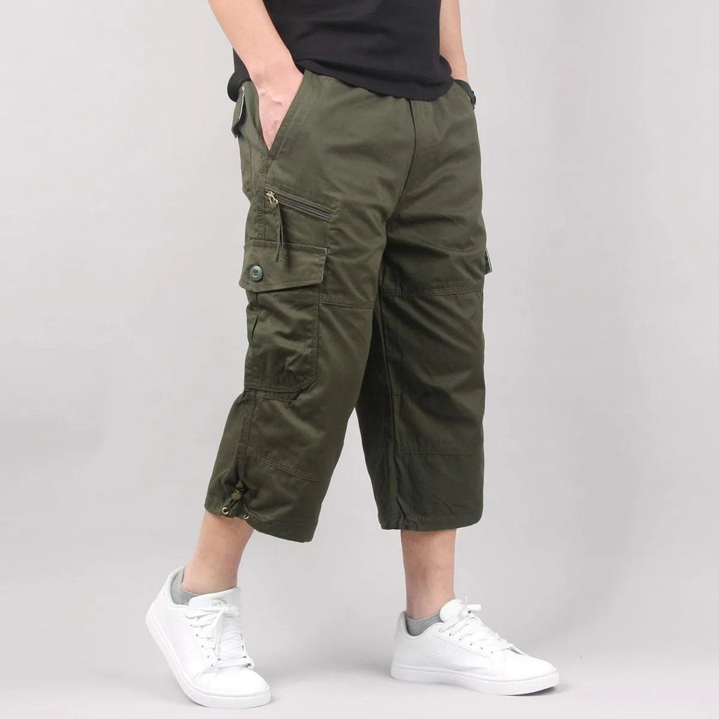Men's loose fit cotton cropped casual pants in khaki, shown on a model.