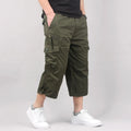 Men's loose fit cotton cropped casual pants in khaki, shown on a model.