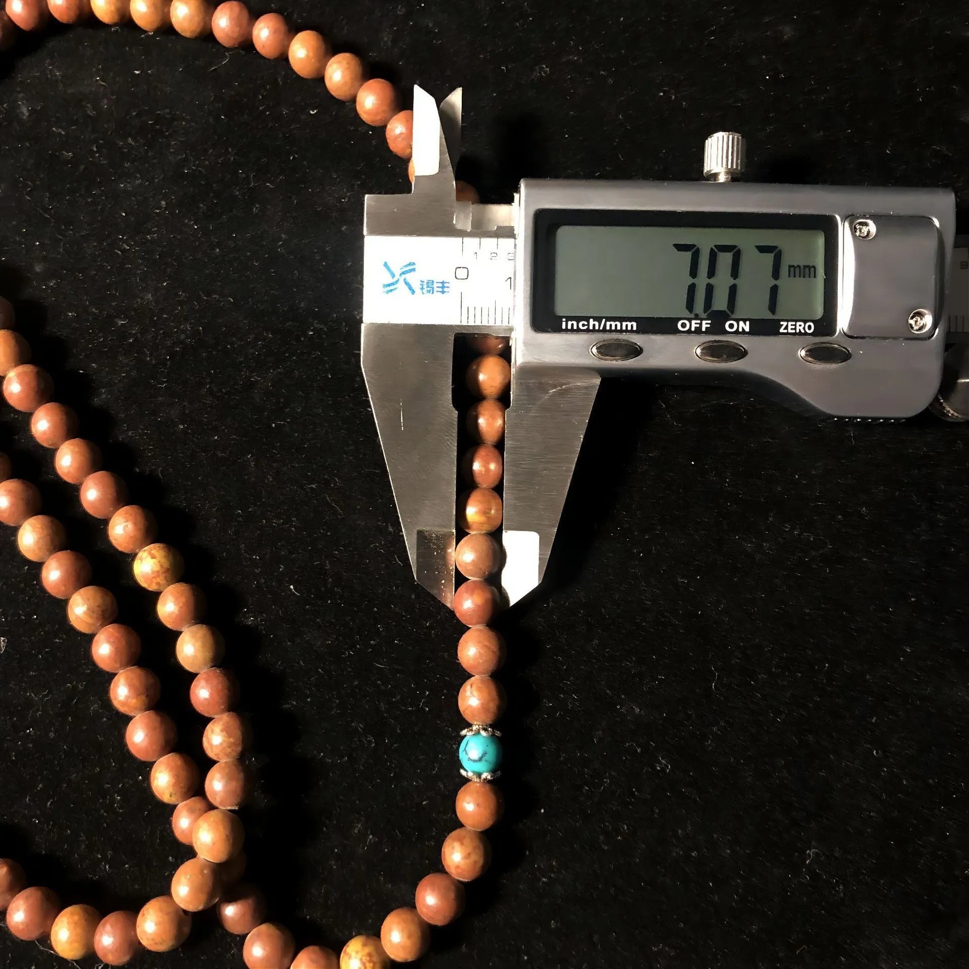 Stone bead bracelet with 108 geometric beads measuring 5-6mm in diameter
