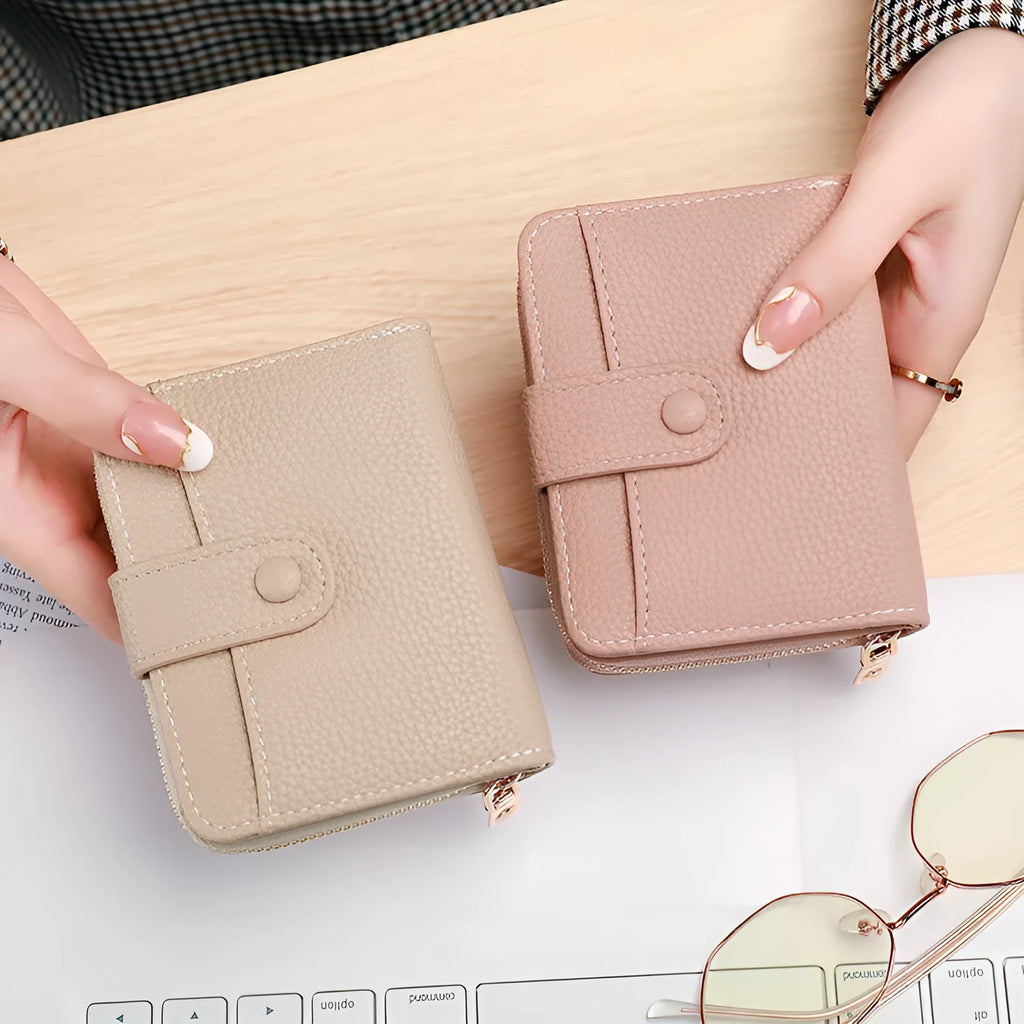 Women's beige lychee pattern short wallet made of PU, showing sewing thread detail and open organiser compartments.