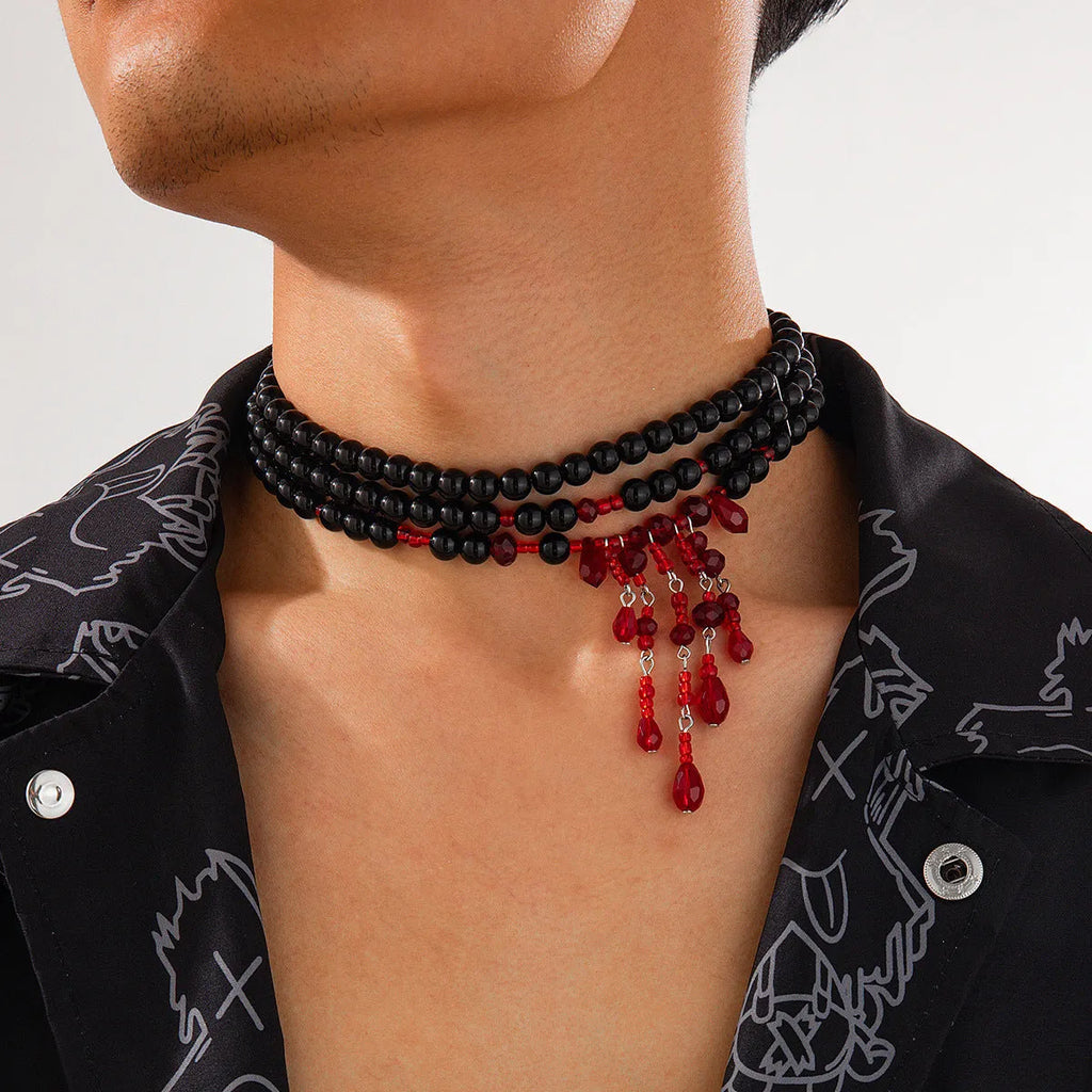 Men's Halloween necklace with red and black crystal blood drop pendant and pearl tassels on an adjustable chain