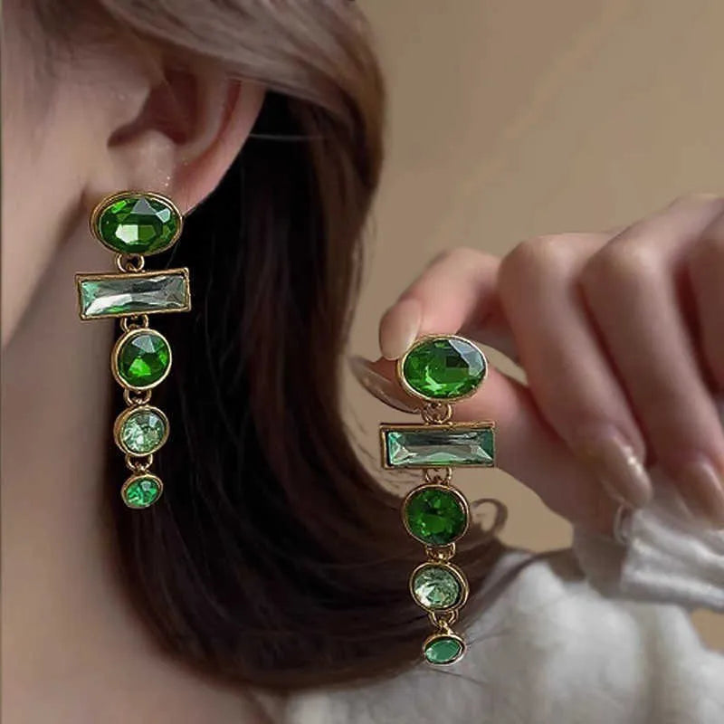 Green zircon and gradient tassel geometric alloy earrings in a retro Chinese style.