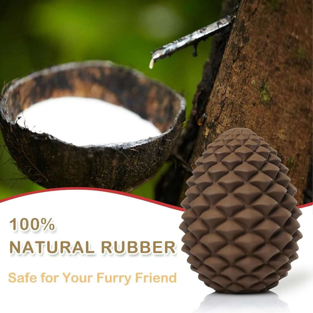Yellow natural rubber pine cone dog chew toy with treat dispenser hole on a white background.