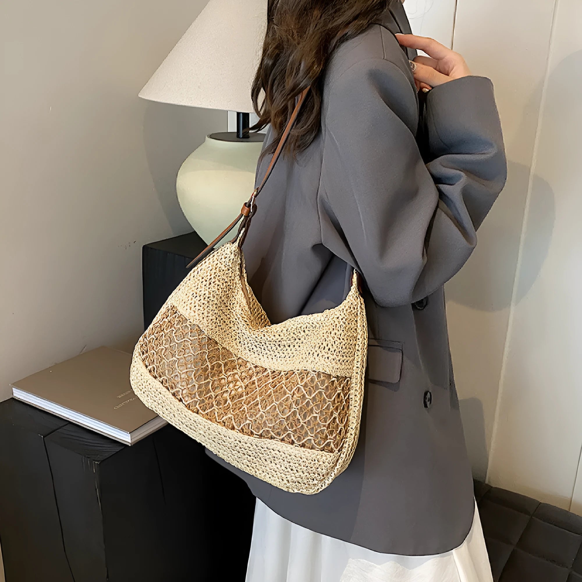Women's khaki straw cross body bag with horizontal square shape and sandwich pocket.