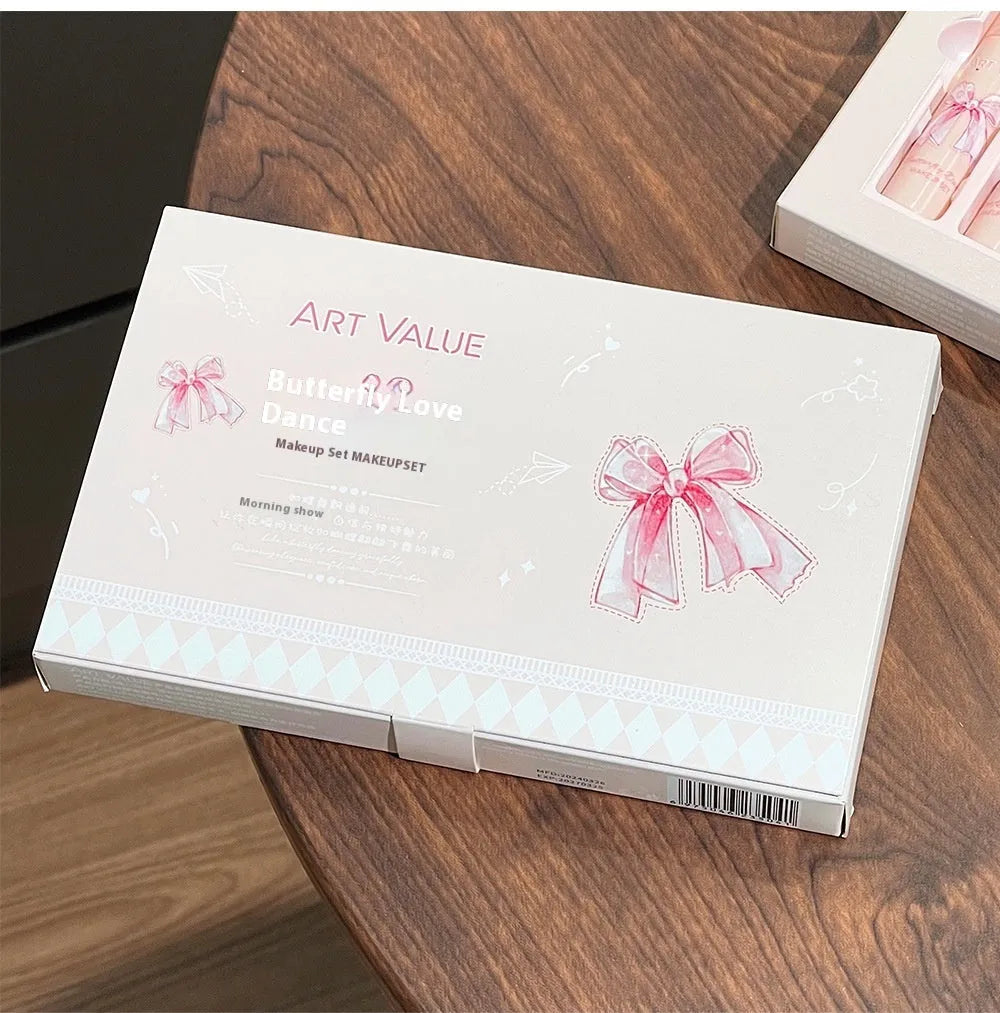 Butterfly box makeup set containing four matte lip muds, powder blusher, and coordinating necklace