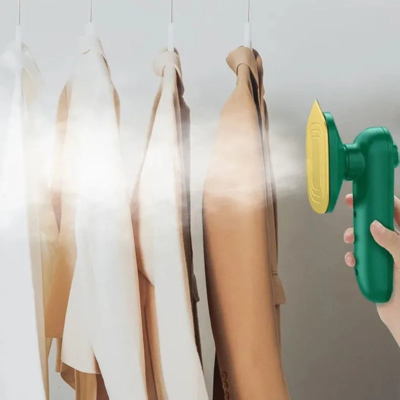 Dark green portable handheld hanging steam iron on a white background.