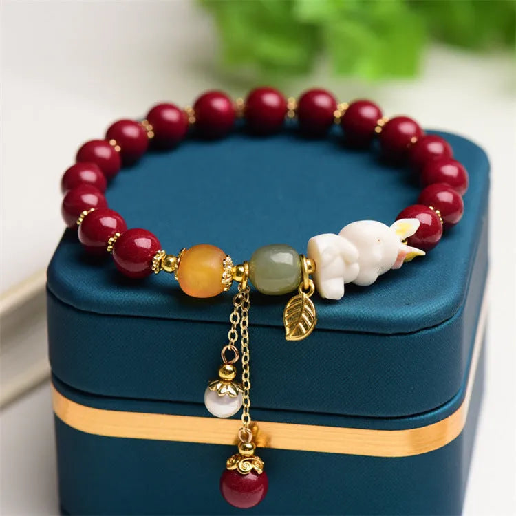 Traditional Chinese cinnabar bracelet with rabbit charm in 8mm or 10mm bead sizes