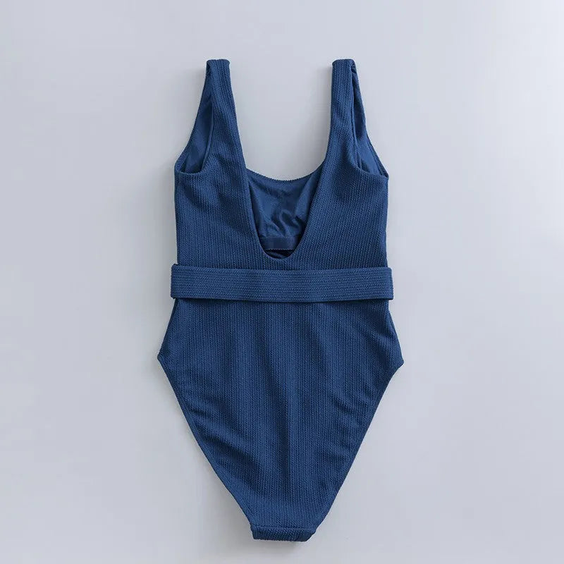 Navy blue women's one-piece slimming triangle swimsuit with chest pads on mannequin