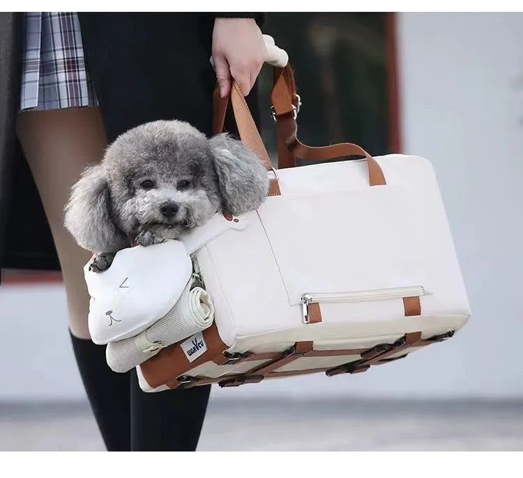 Beige hard-shell pet flight case with one-shoulder strap for cats and small dogs