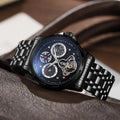 Men's automatic waterproof watch with luminous hands on a steel bracelet, showing a black dial in a 13mm thick case.