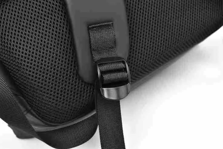 Men's waterproof PU backpack in black with simple sewing thread design and separate computer compartment.