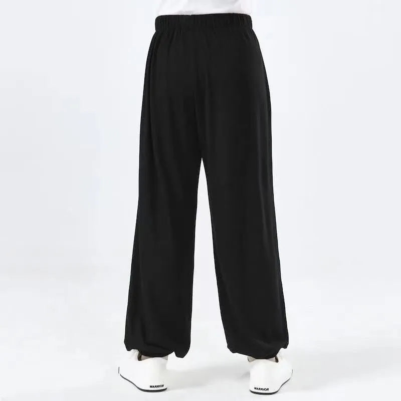 Children's black high-elasticity Sanda practice pants made from lycra and spandex fabric.